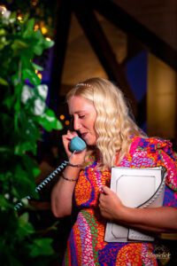 Female guests using audio guest book to leave an audio message