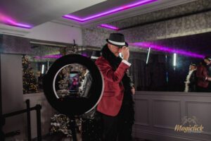 A couple posing for photos on the 360 using props