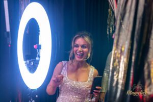 A pretty lady getting ready to have her photo taken on the 360